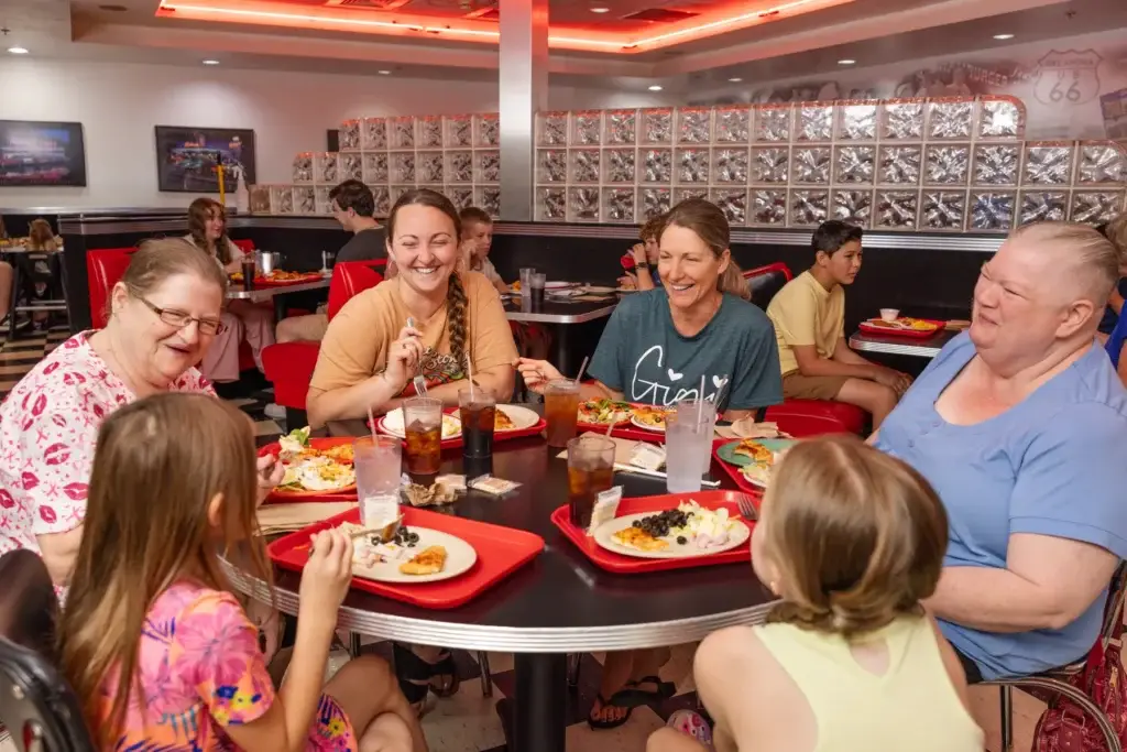 Guests dining at Incredible Food & Fun, illustrating how brand promises become real through repeatable operations and guest experience.